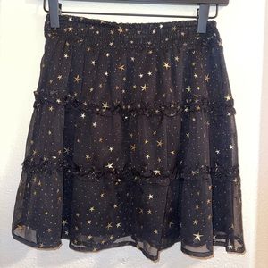 Black skirt with gold stars.